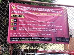 Lona de la Secretaría de Salud que avisa es zona de Altísimo Contagio. Afuera metro San Antonio. Fotografía del 29 de junio del 2021 por Ulises Felipe Chávez Valdovinos.