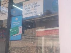 Cartel  Se reciben vales de apoyo COVID y se cambian por efectivo, Farmacia de Dios, Colonia Plan de Ayala, Tlalpan. Fotografía: Ángel Alberto Blancas Rivera. 