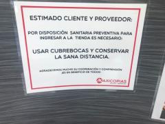 Cartel anunciando a sus clientes las medidas de prevención, Maxicopias, Letrán Valle, CdMx. Fotografía: Gloria Elisa Melgarejo García.