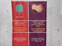 Lona informativa sobre uso correcto de bata y guantes quirúrgicos. Fotografía: David Alonso Vargas Melgarejo
