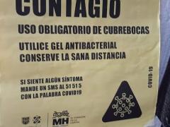Anuncio ¡Cuidado! Zona de alto contagio, cercanías del Mercado de Garda. Fotografía: David Alonso Vargas Melgarejo.